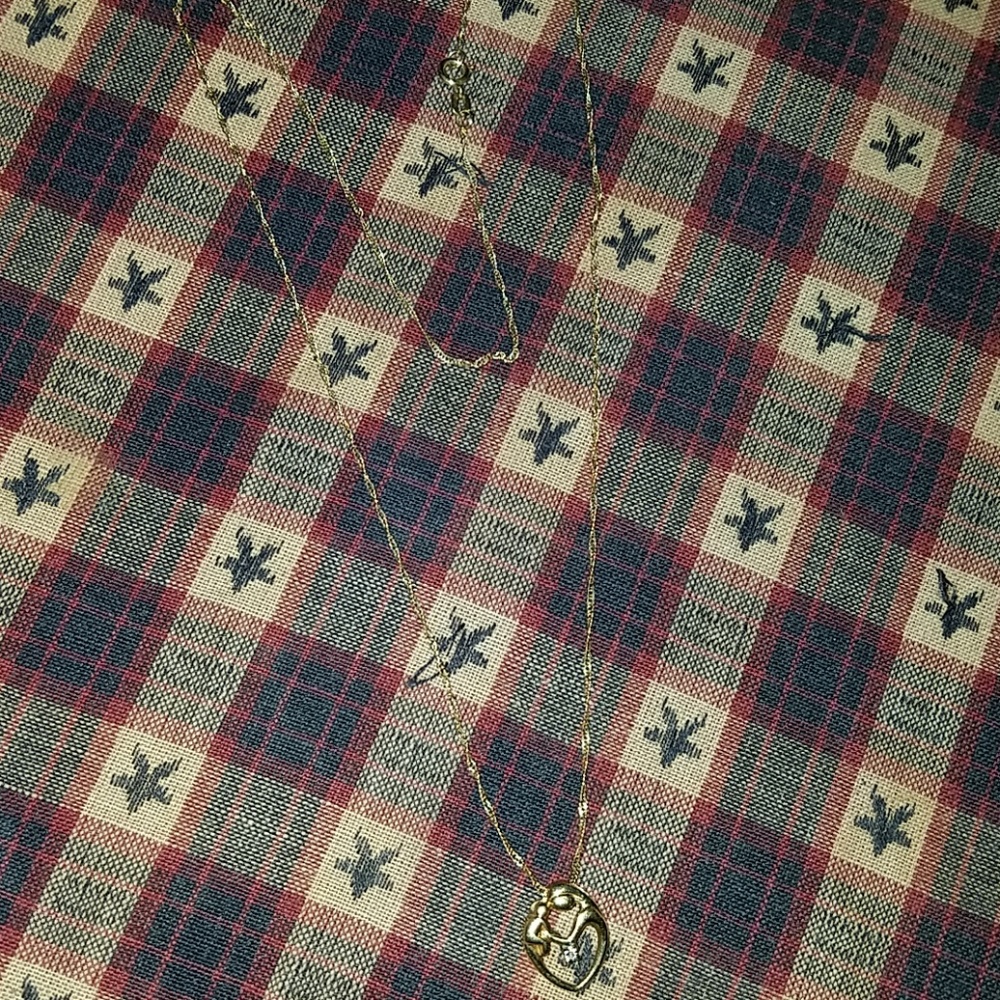 Beautiful mother holding child with diamond